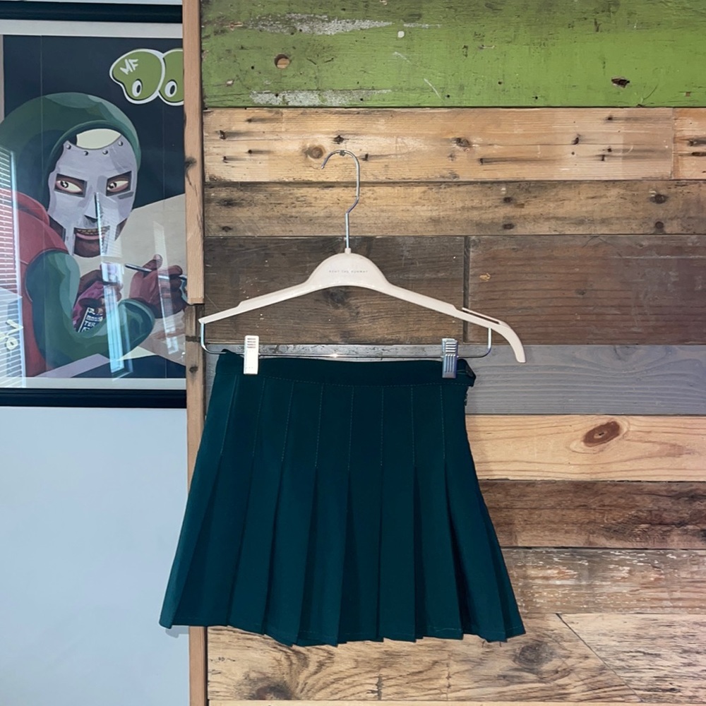 Cool pleated dark green skirt.